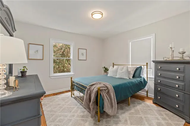 a bedroom with a bed and a desk