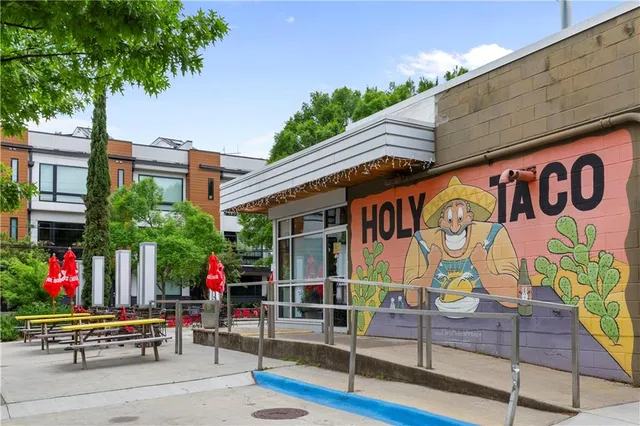 a front view of a building with street view