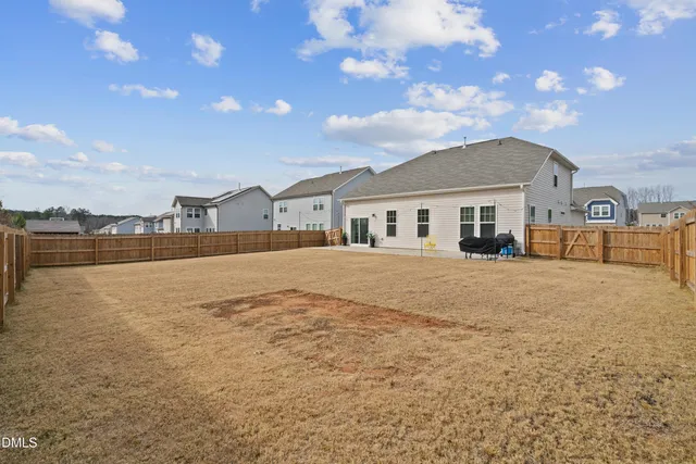 a view of house with outdoor space and sitting area