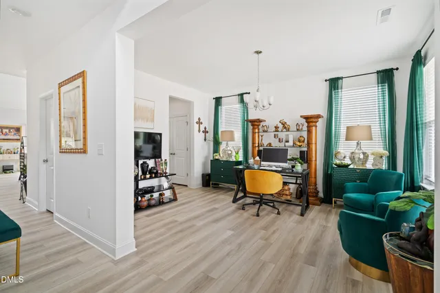 a balcony with furniture and wooden floor