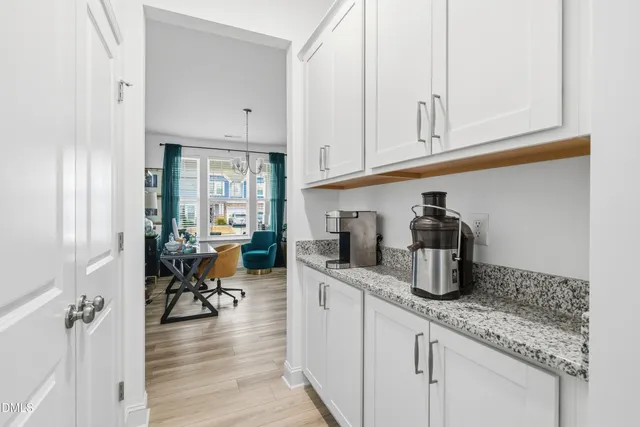 a kitchen with sink and cabinets