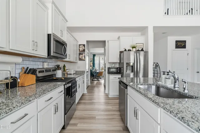 a kitchen with granite countertop a sink and counter space