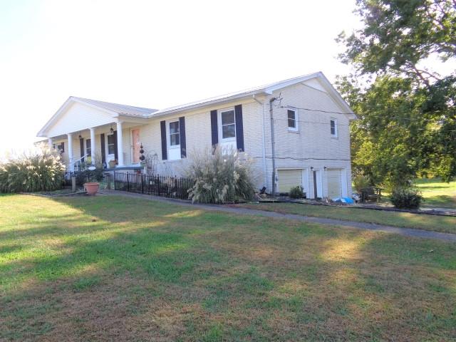 2069 Fall River Road Leoma, TN 38468 - Photo 1 of 26 a front view of house with yard and green space