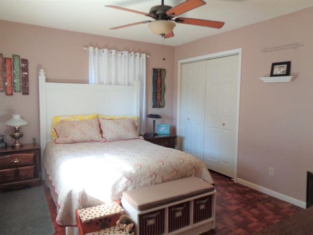 2069 Fall River Road Leoma, TN 38468 - Photo 11 of 26 a bedroom with a bed and a chandelier