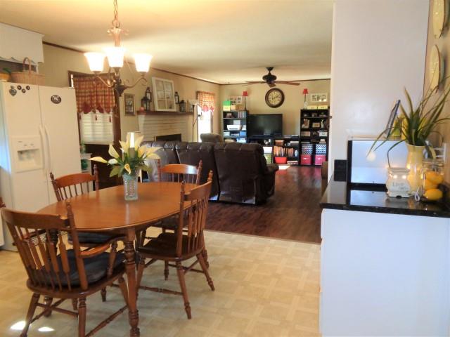 2069 Fall River Road Leoma, TN 38468 - Photo 7 of 26 a view of a dining room with furniture and chandelier