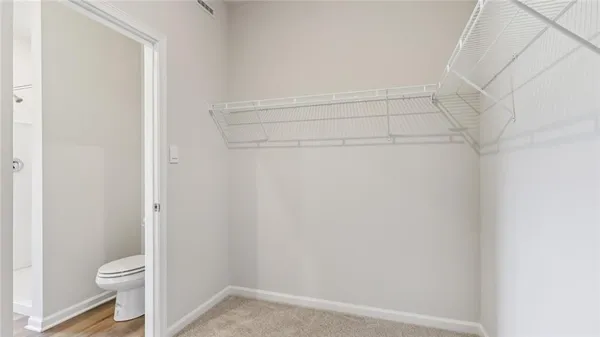 a view of an empty walk in closet