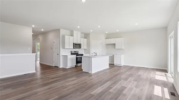 a view of kitchen with wooden floor