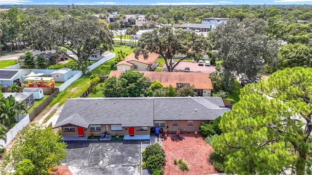a front view of a house with a yard and outdoor seating
