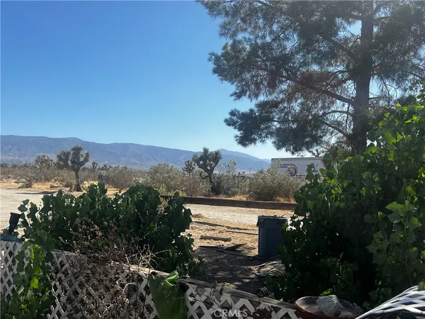 a kitchen with granite countertop a sink stove and cabinets