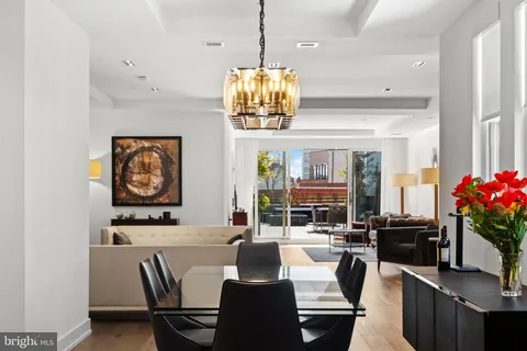 a dining room with furniture and window