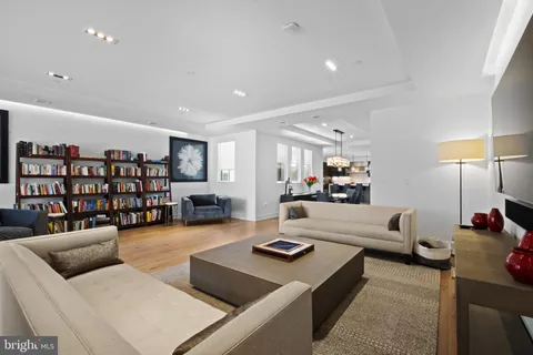 a living room with furniture and white walls