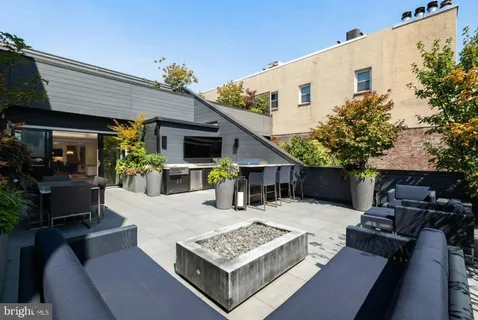 a view of house with outdoor seating and a patio