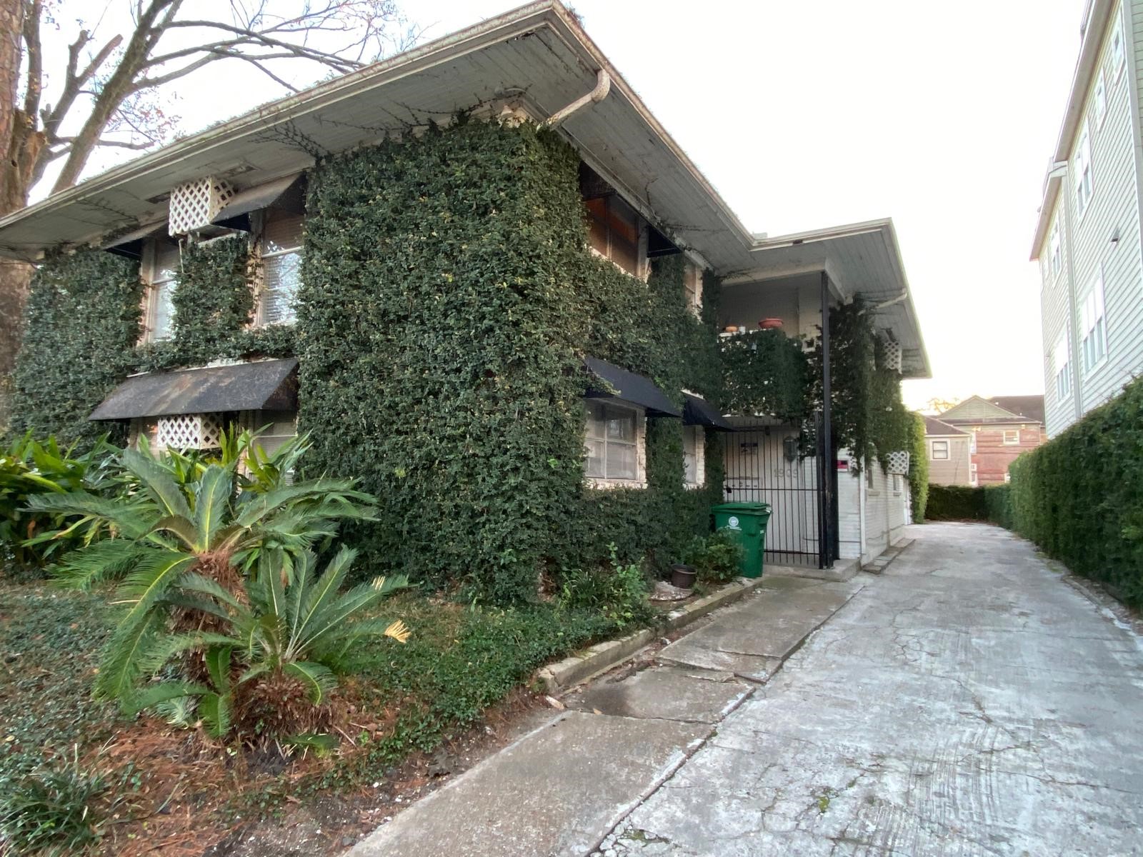 1909 Colquitt Street, Unit 3 Houston, TX 77098 - Photo 1 of 16 a view of a house with a yard and plants