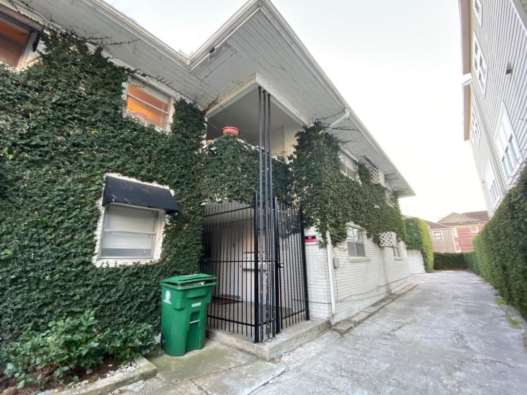 1909 Colquitt Street, Unit 3 Houston, TX 77098 - Photo 2 of 16 a backyard of a house with plants and outdoor seating