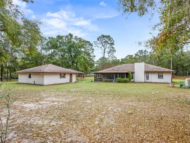 a house with trees in the background