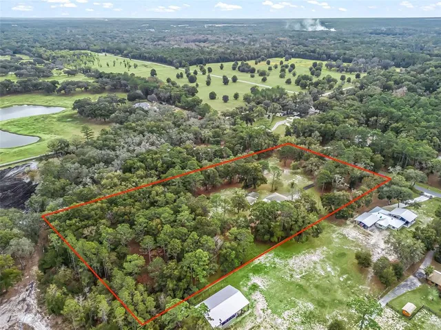 a view of a yard with an outdoor space