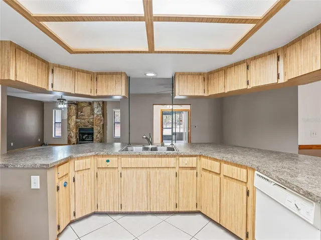 a kitchen with stainless steel appliances granite countertop a sink and cabinets