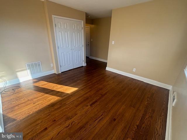 3804 Cedarhurst Road Baltimore, MD 21206 - Photo 7 of 10 a view of an empty room with wooden floor