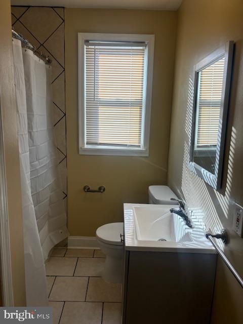3804 Cedarhurst Road Baltimore, MD 21206 - Photo 10 of 10 a bathroom with a sink a toilet and shower