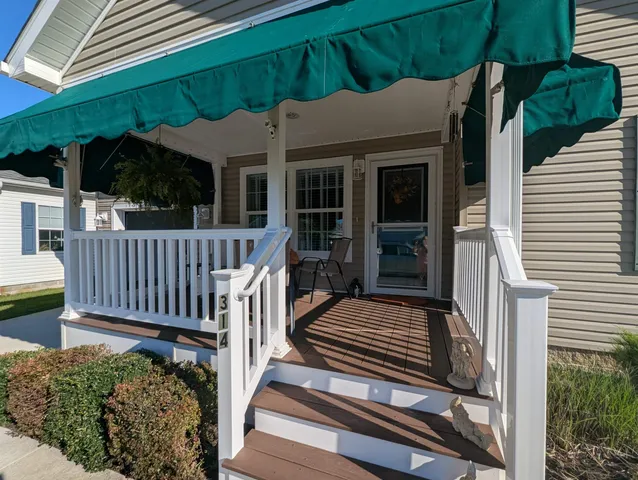 a view of a house with a small yard