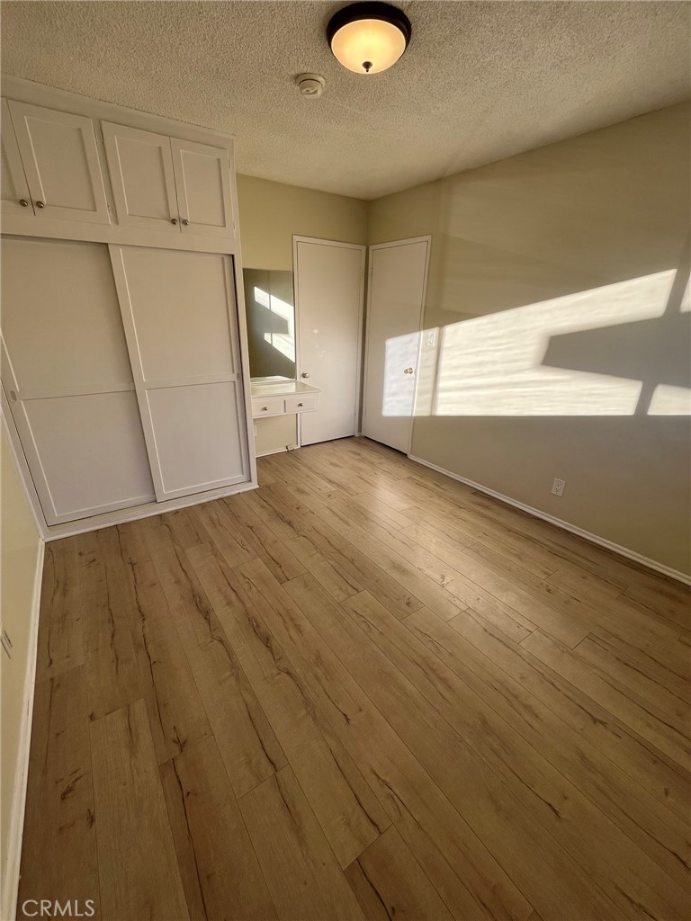 14632 Erwin Street, Unit 7 Van Nuys, CA 91411 - Photo 6 of 11 a view of a room with wooden floor