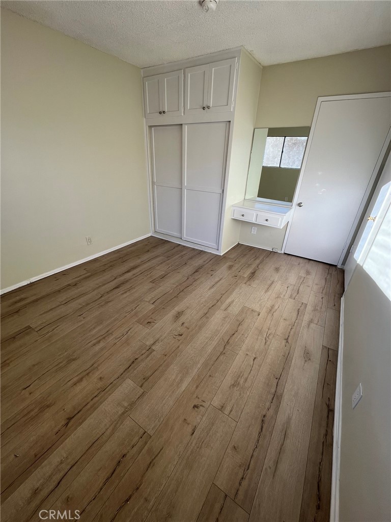 14632 Erwin Street, Unit 7 Van Nuys, CA 91411 - Photo 7 of 11 a view of a kitchen with wooden floor