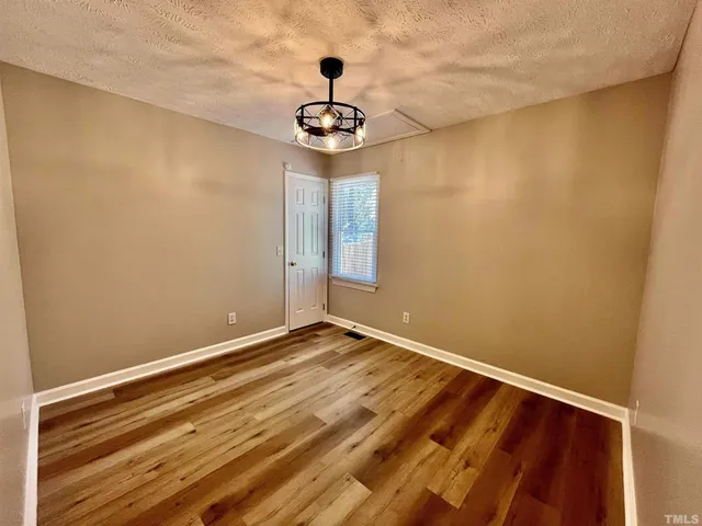 a view of room with window and ceiling fan
