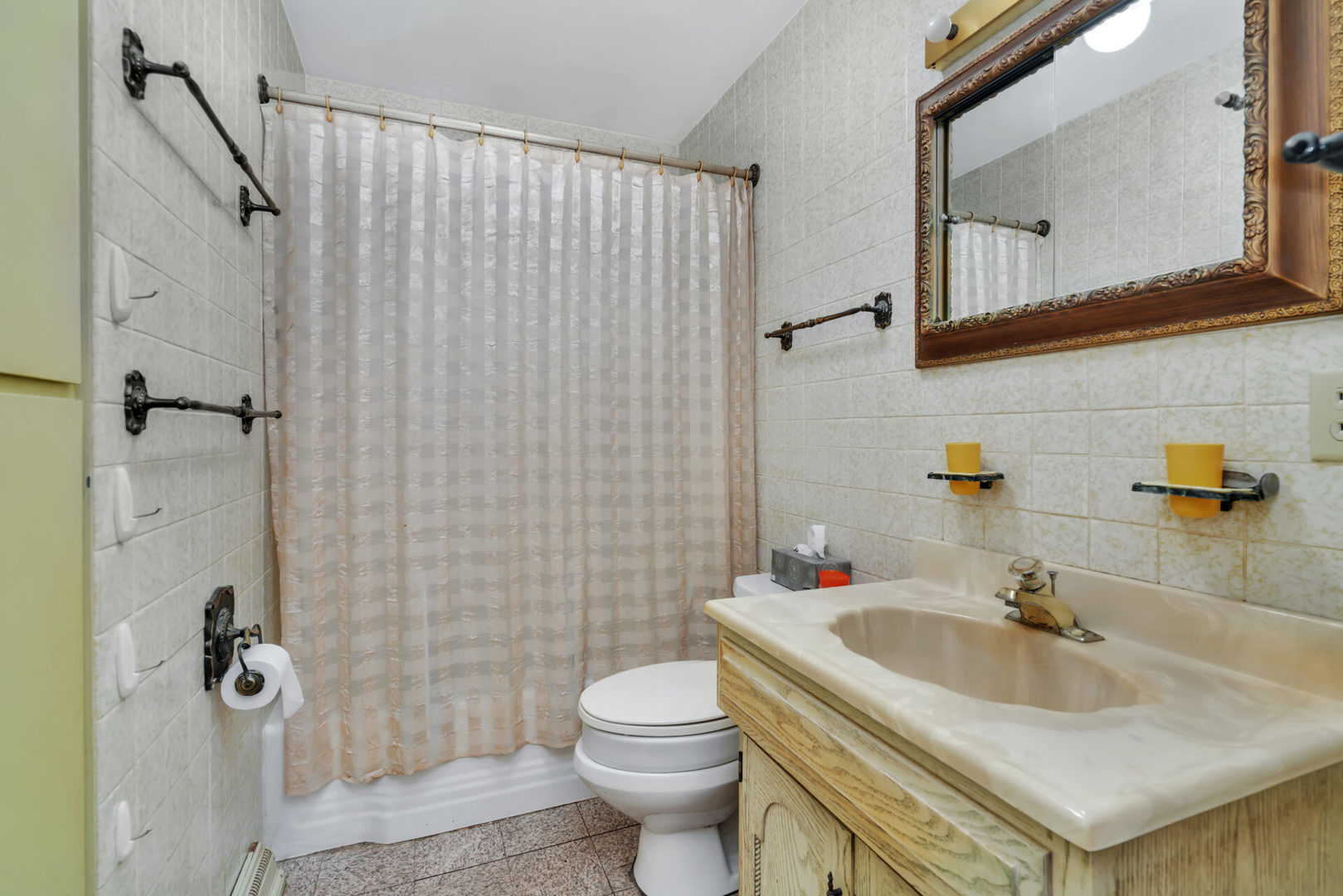 96 South Street Cary, IL 60013 - Photo 10 of 14 a bathroom with a sink toilet and shower