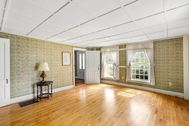 a view of an empty room with glass door