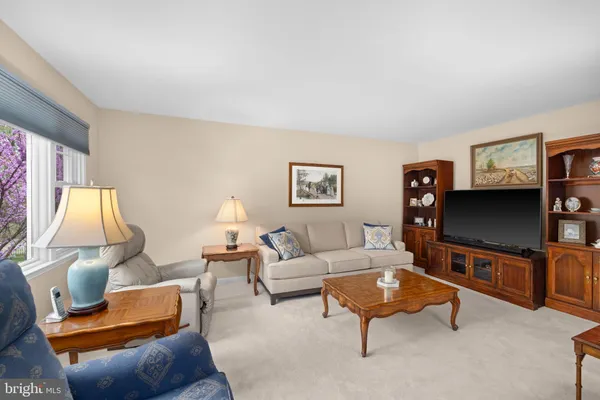a view of a dining room with furniture and a livingroom