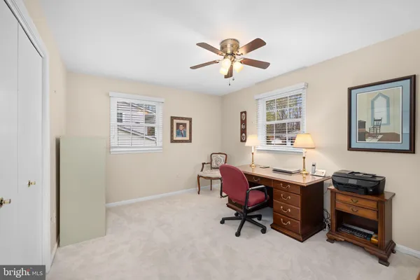 a bedroom with a bed and a night stand