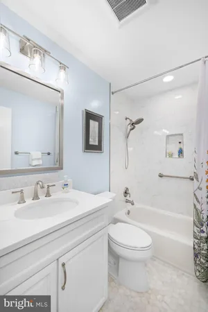 a bathroom with a sink a toilet and a bathtub