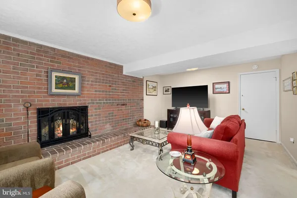 a spacious bedroom with a bed and flat screen tv