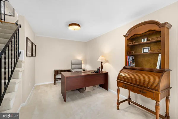 a spacious bedroom with a bed and a table chair