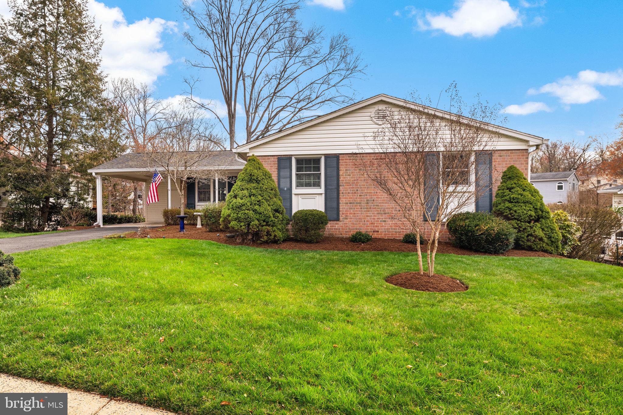 6964 Conservation Drive Springfield, VA 22153 - Photo 39 of 57 a front view of house with a garden and plants