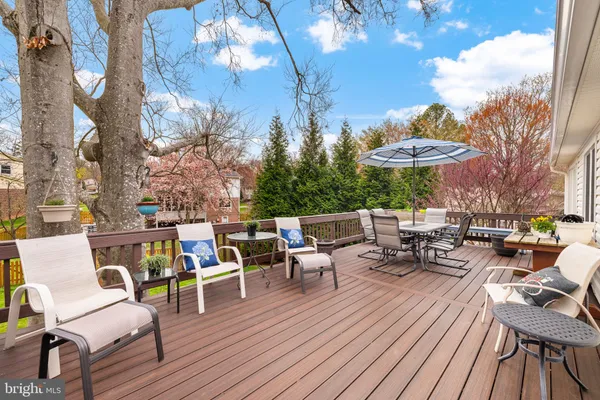 a view of swimming pool with outdoor seating and yard