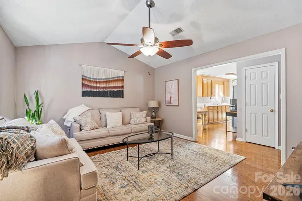 a living room with furniture and a rug