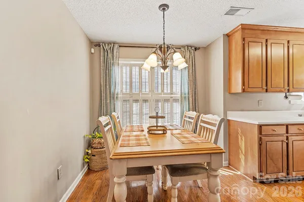 a view of a dining room with furniture and window