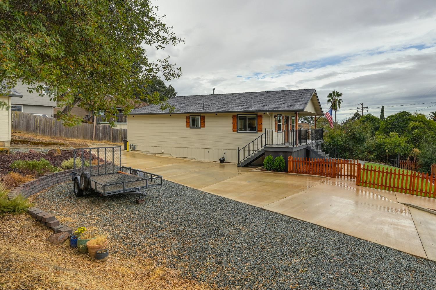 314 East Main Street Ione, CA 95640 - Photo 2 of 43 a front view of a house with a garden