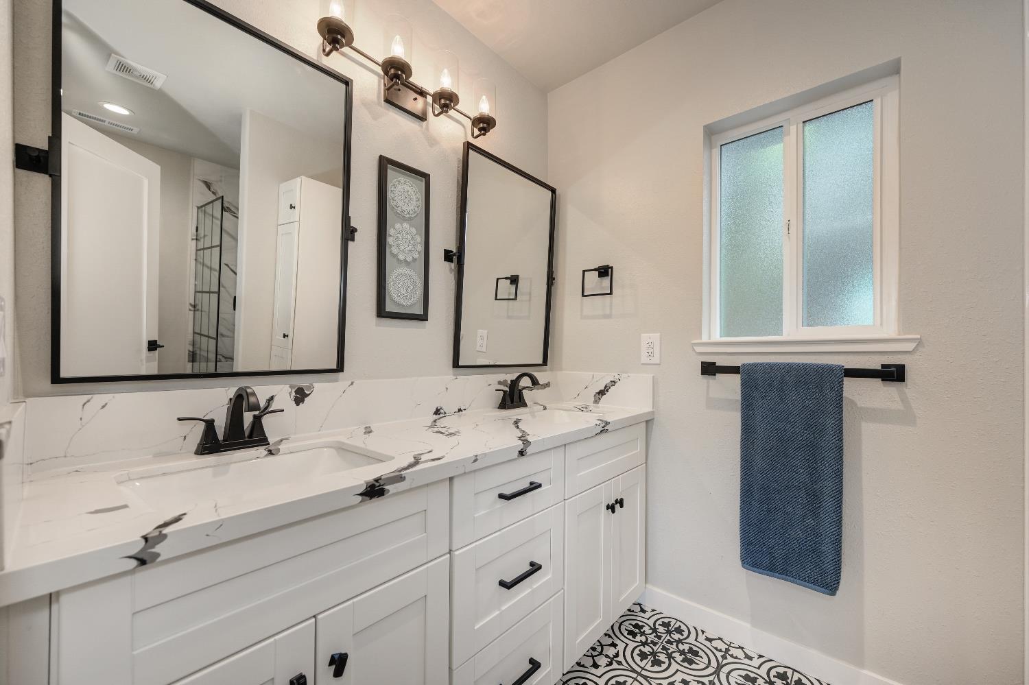314 East Main Street Ione, CA 95640 - Photo 26 of 43 a bathroom with a double vanity sink mirror and