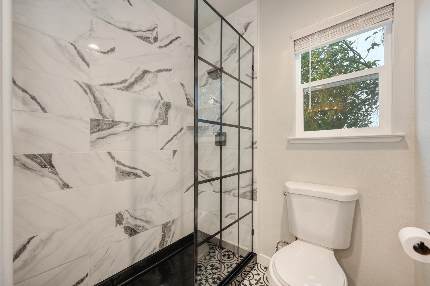 314 East Main Street Ione, CA 95640 - Photo 27 of 43 a bathroom with a toilet sink and shower