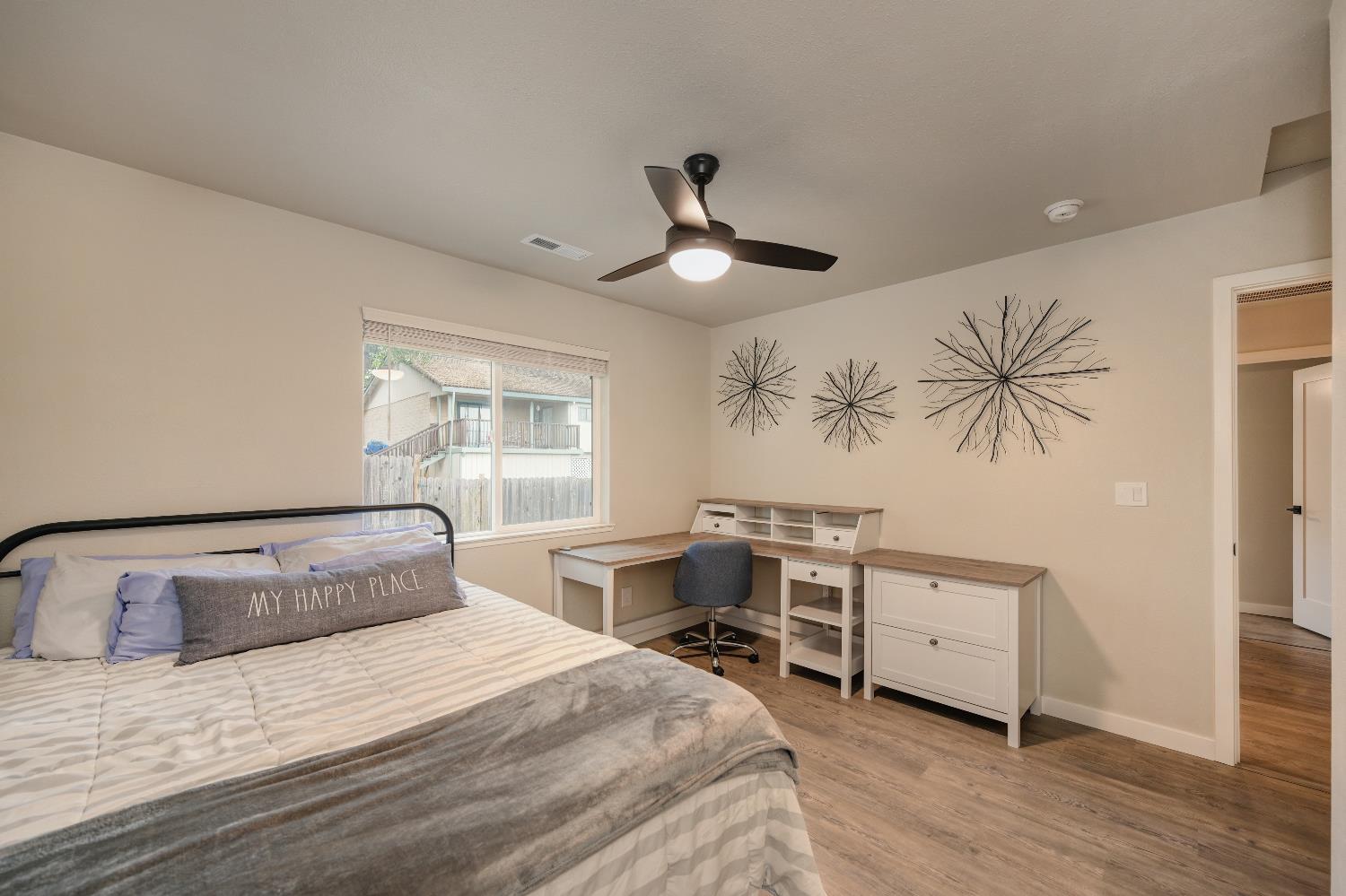 314 East Main Street Ione, CA 95640 - Photo 29 of 43 a bedroom with a bed and a table