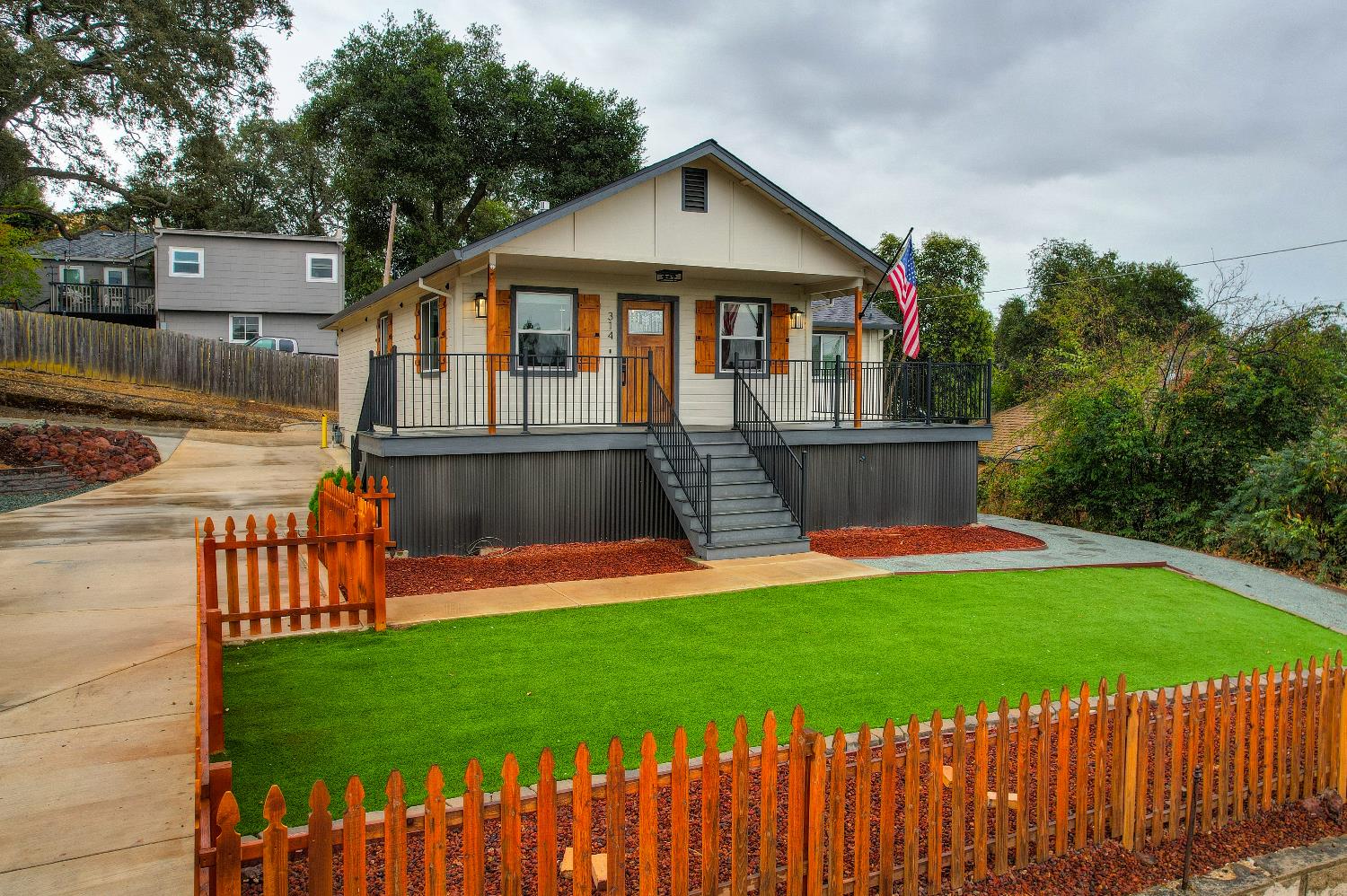 314 East Main Street Ione, CA 95640 - Photo 40 of 43 a front view of a house with a yard patio and a slide