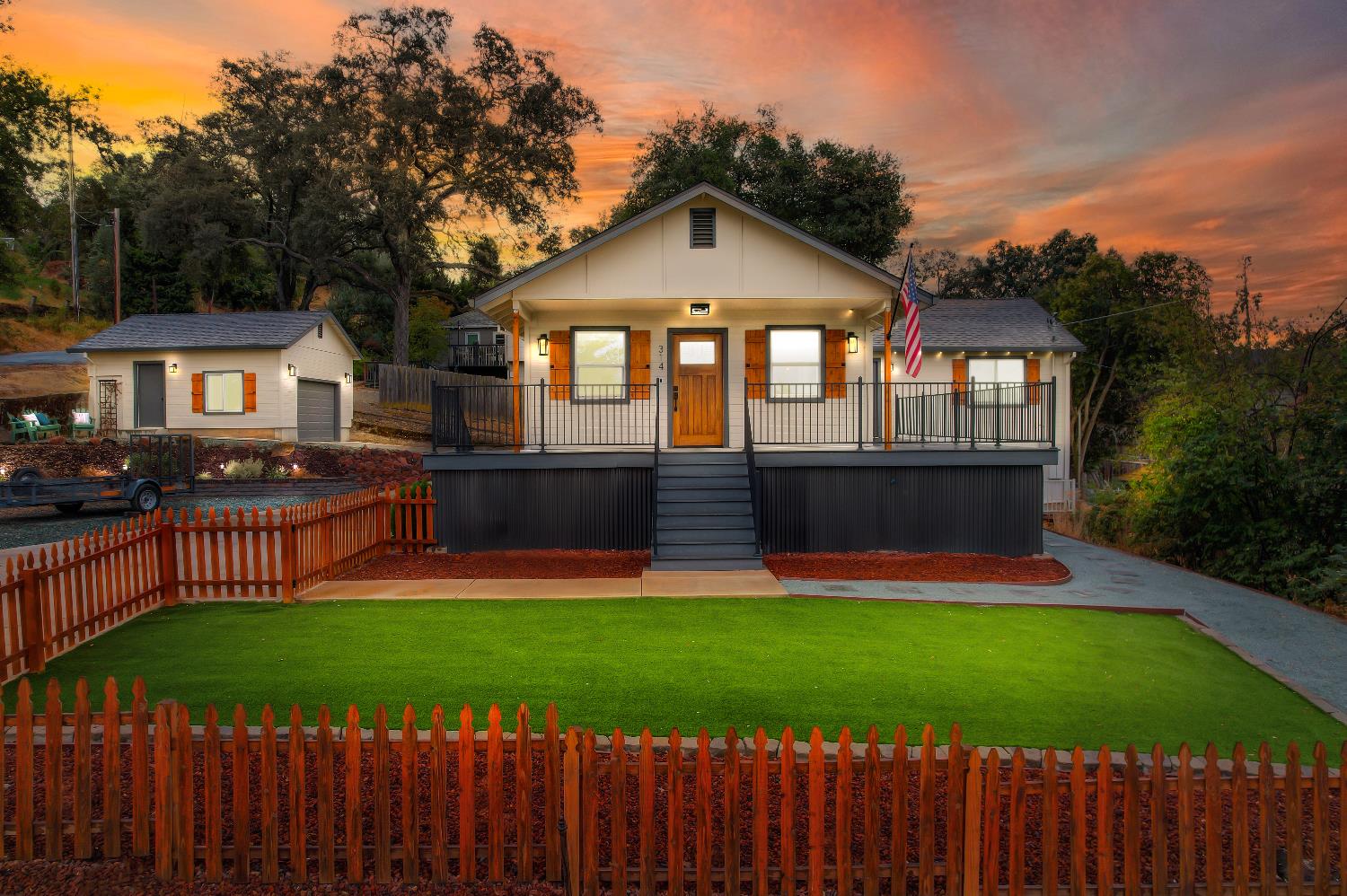 314 East Main Street Ione, CA 95640 - Photo 41 of 43 a front view of a house with a yard and trees