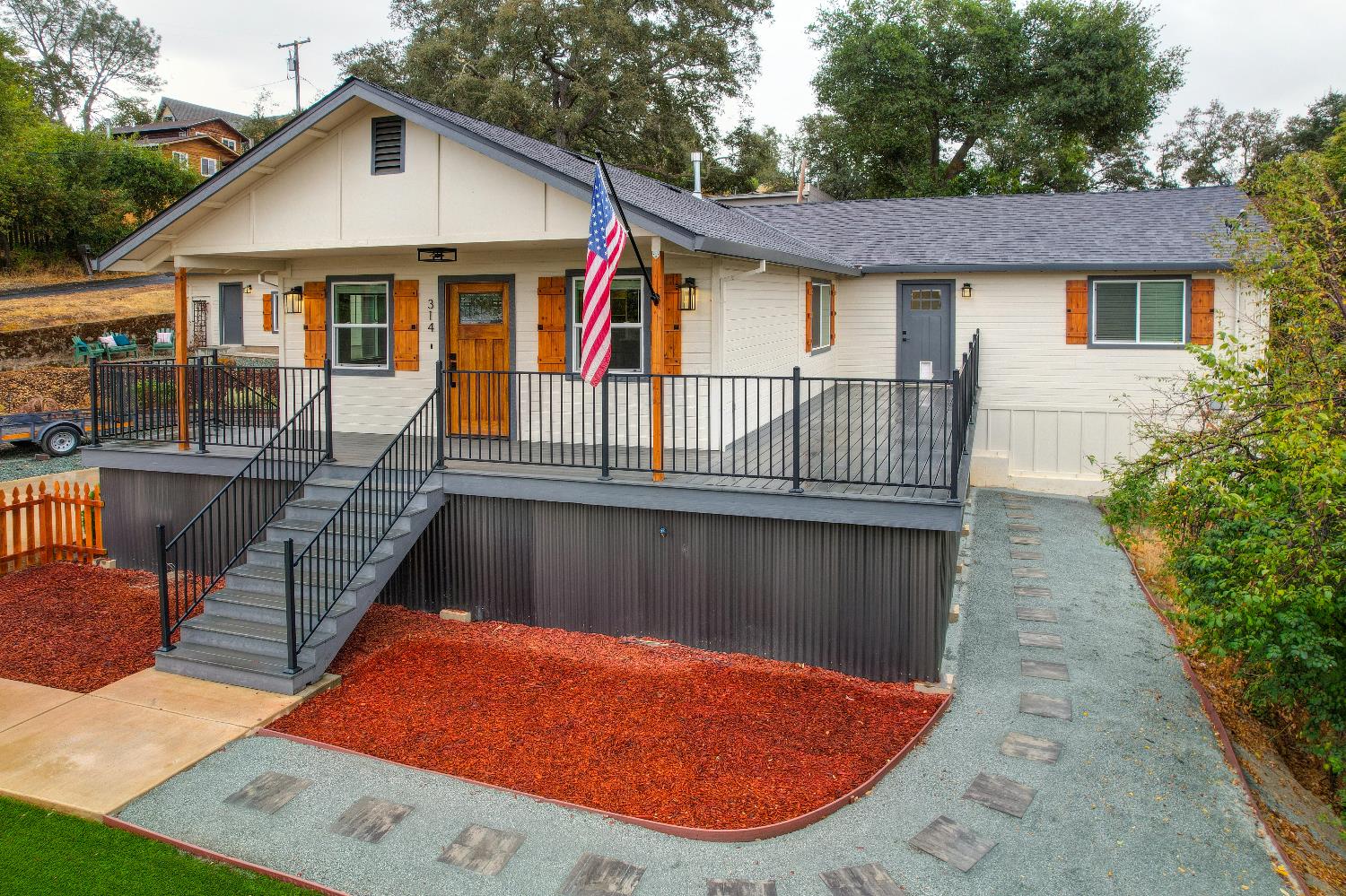 314 East Main Street Ione, CA 95640 - Photo 42 of 43 a view of a white house with a swimming pool