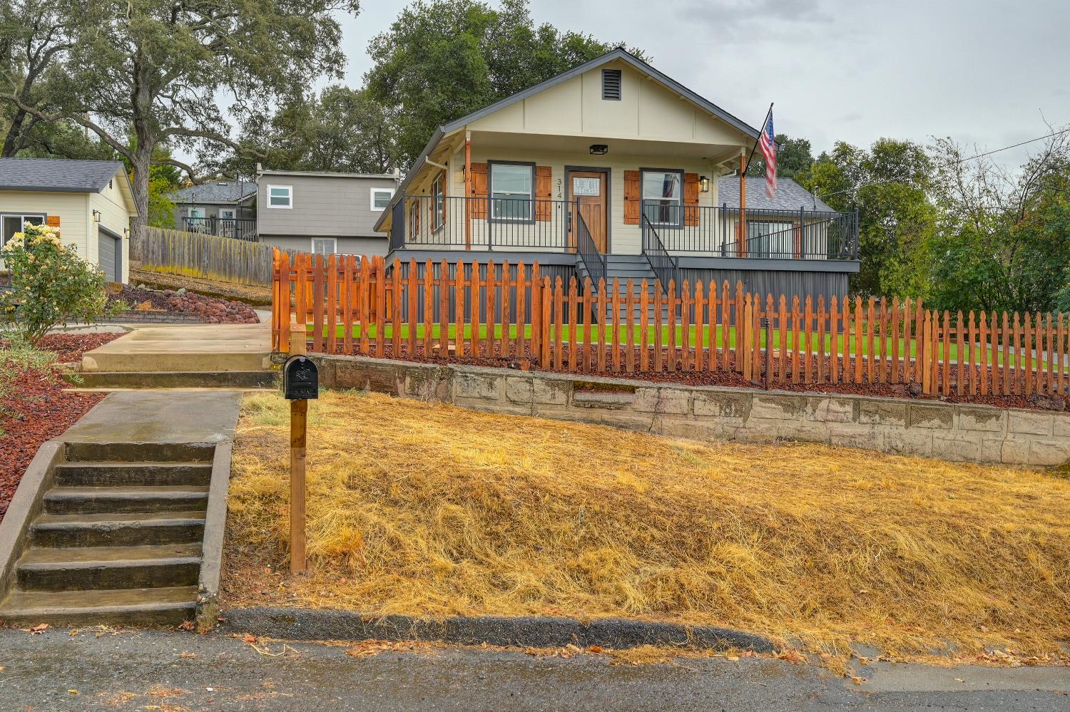 314 East Main Street Ione, CA 95640 - Photo 5 of 43 a view of a house with wooden floor next to a yard