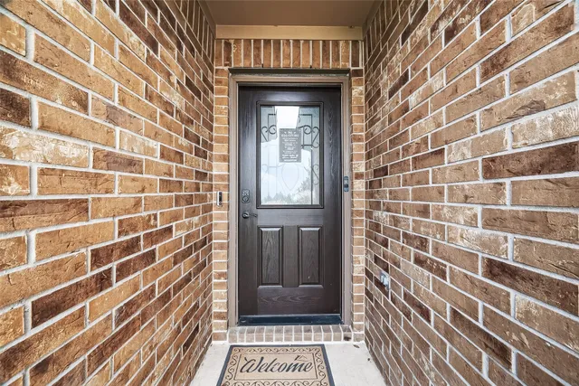 a view of a door and a window
