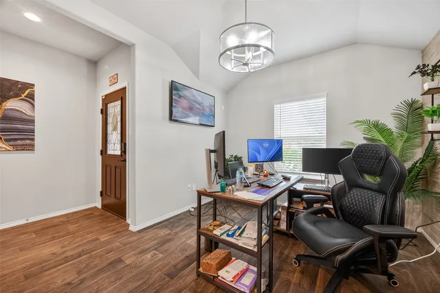 a workspace with furniture and wooden floor