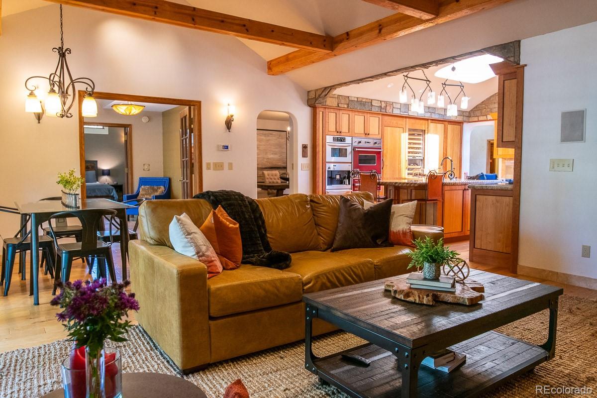 7181 Four Rivers Road Boulder, CO 80301 - Photo 12 of 35 a living room with furniture and a large window