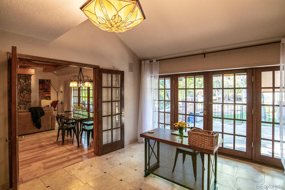 7181 Four Rivers Road Boulder, CO 80301 - Photo 14 of 35 a view of a dining room with furniture window and outside view